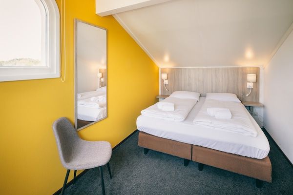 Slaapkamer - Dunimar Gezellig Vakantiehuis in Noordwijkerhout (4)