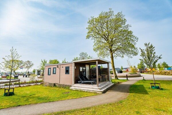 Buitenkant - Huisdiervriendelijk verblijf in een lodge in Maurik (1)