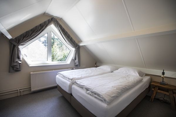 Slaapkamer - Vakantiehuis in Nijmegen bij Centrum in Mook (4)