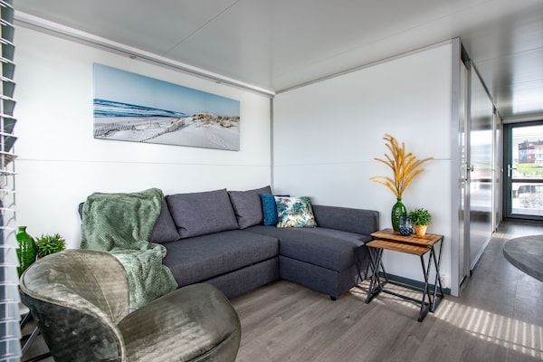 Woonkamer - Waterlodge Kamperland met Uitzicht Terras in Kamperland (2)