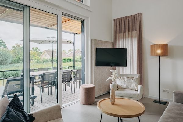 Woonkamer - Moderne lodge vlakbij het strand in Breskens (2)