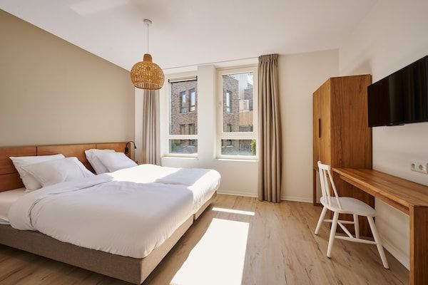 Slaapkamer - Ruim appartement nabij wellness in Maastricht (1)