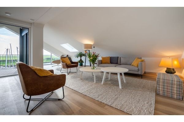 Woonkamer - Adembenemend penthouse-uitzicht in Kamperland (1)
