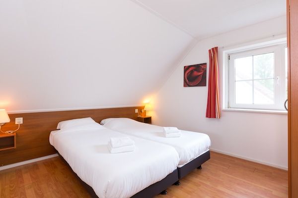 Slaapkamer - Charmante schuilplaats nabij het bos in Hellendoorn (5)