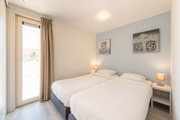Slaapkamer - Gezellige Lodge bij Hollum in Hollum (1)