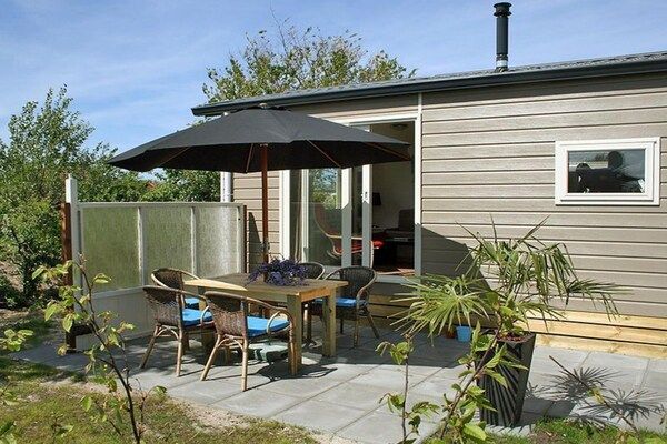 Terras - Mooi chalet tussen golfbaan en strand in Hollum (3)