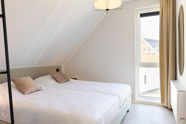 Slaapkamer - Vakantiehuis in een vakantiepark in Nieuwvliet (3)