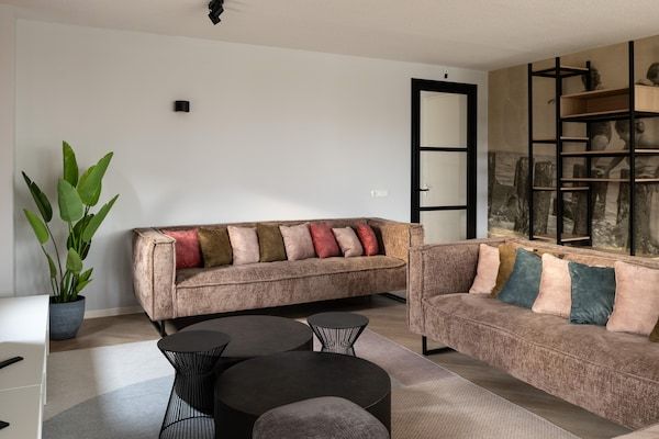 Woonkamer - Vakantiehuis bij Noordzeestrand met Sauna in Nieuwvliet (2)