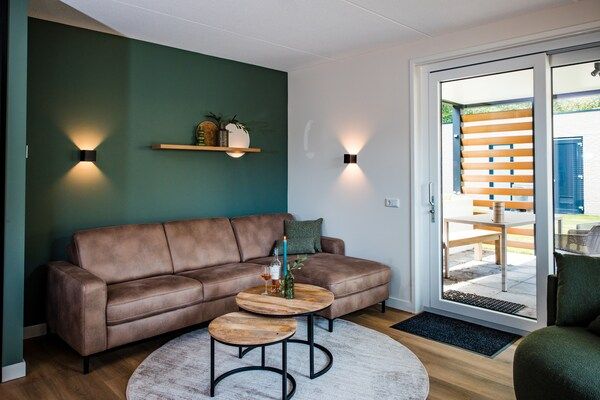 Woonkamer - Vakantiehuis in Veluwe met zwembad en sauna in Voorthuizen (4)