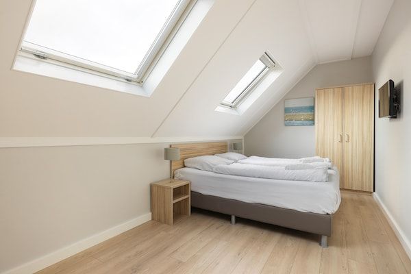 Slaapkamer - Gezellig Zeeuws strandverblijf in Nieuwvliet (4)