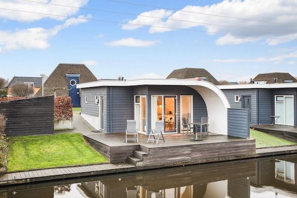 Buitenkant - Bungalow aan het meer met sauna in Midlaren (1)