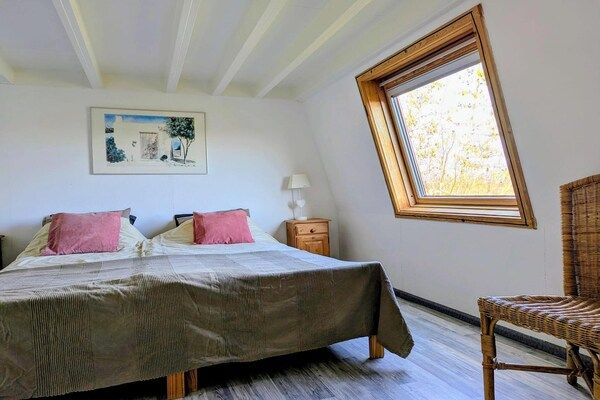 Slaapkamer - Zonovergoten vakantiehuis aan zee in Breskens (4)