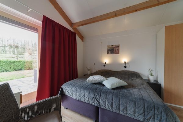 Slaapkamer - Oesterkust: sauna en familiecharme in Wemeldinge (4)