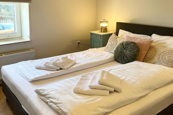 Slaapkamer - Vakantiehuis in Voerendaal met terras in Voerendaal (2)