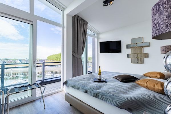 Slaapkamer - Penthouse met uitzicht op het strand in Sint-Annaland (4)