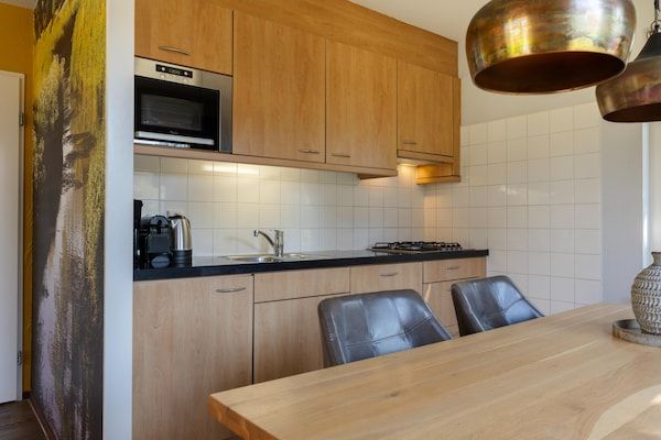 Keuken - Weelderige bungalow met privé-bubbelbad in Diessen-Baarschot (4)
