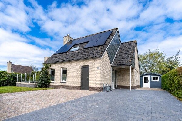 Buitenkant - Sfeervolle villa met houtkachel nabij zee en bos in De Koog (2)