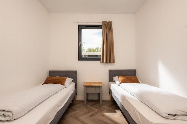 Slaapkamer - Charmante eikenlodge vlakbij Holterberg in Rijssen (3)