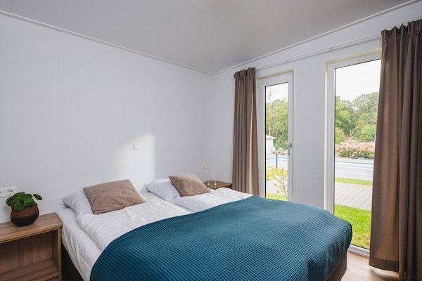 Slaapkamer - Luxe boslodge met privésauna in Rijssen (3)