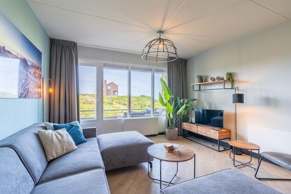 Woonkamer - 2 persoons eiland-zeezicht appartement met sauna in De Koog (2)