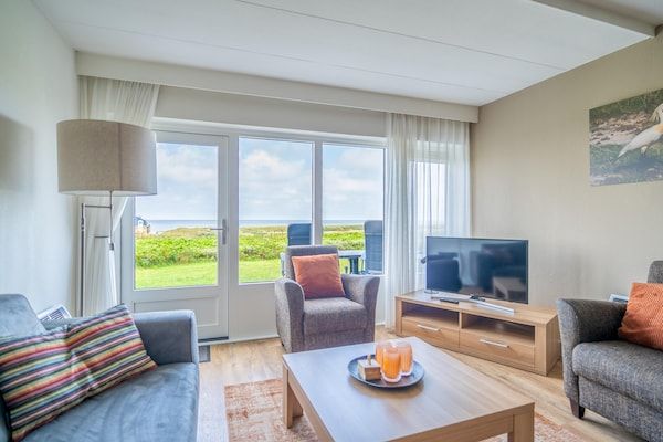 Woonkamer - 4 Persoons appartement met zeezicht in De Koog (2)