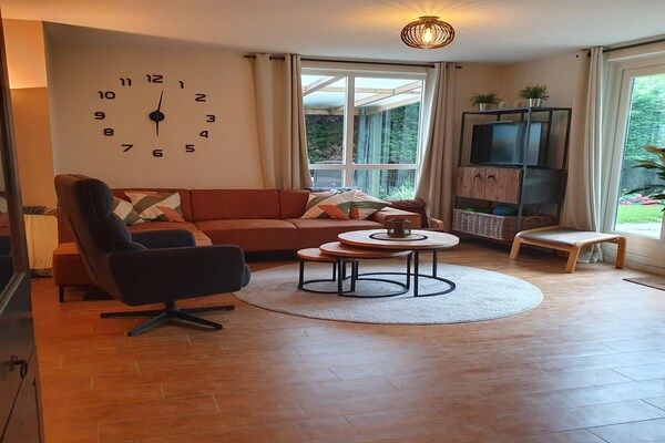Woonkamer - Bosbungalow met sauna voor 6 personen in Ewijk (2)