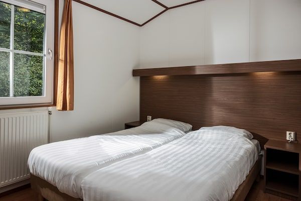 Slaapkamer - Gezellig chalet in het Borgerbos in Borger (5)