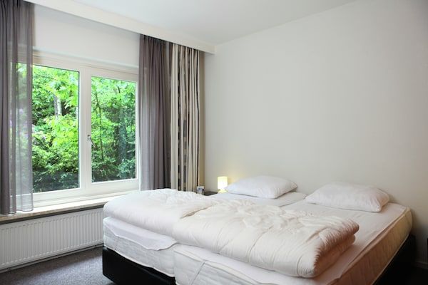 Slaapkamer - Villa van de Veluwe Edge Groep met vuurplaats in Doornspijk (5)