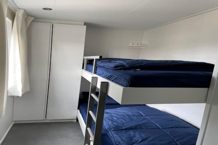 Een slaapkamer van Pavilion l'etage 44 in Kaatsheuvel