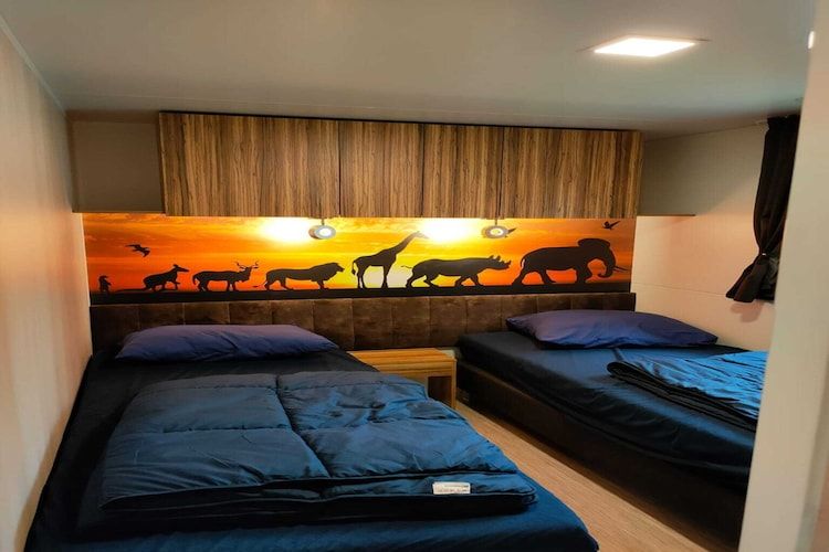 Een slaapkamer van Cottage 4 in Kaatsheuvel