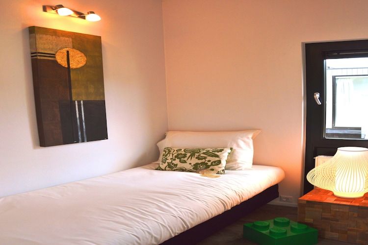 Een slaapkamer van Cube la Mer 4 in Breskens