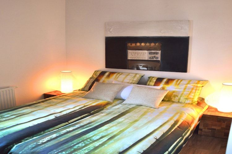 Een slaapkamer van Cube la Mer 4 in Breskens